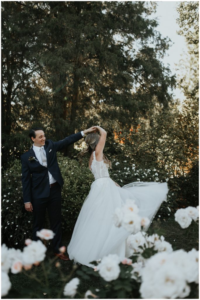 pnw backyard wedding couple dancing white roses