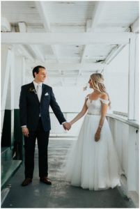 pnw skansonia couple holding hands waterfront micro wedding Seattle