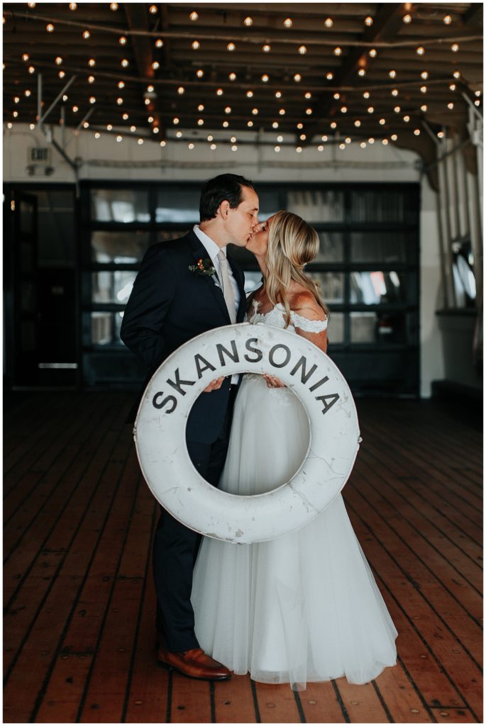 The Skansonia seattle waterfront micro wedding couple kissing