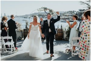 pnw wedding couple walking down the isle