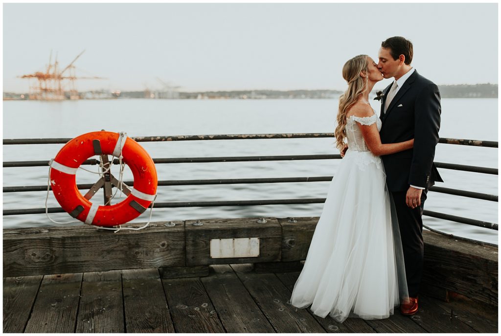 the skansonia micro wedding waterfront wedding couple kissing