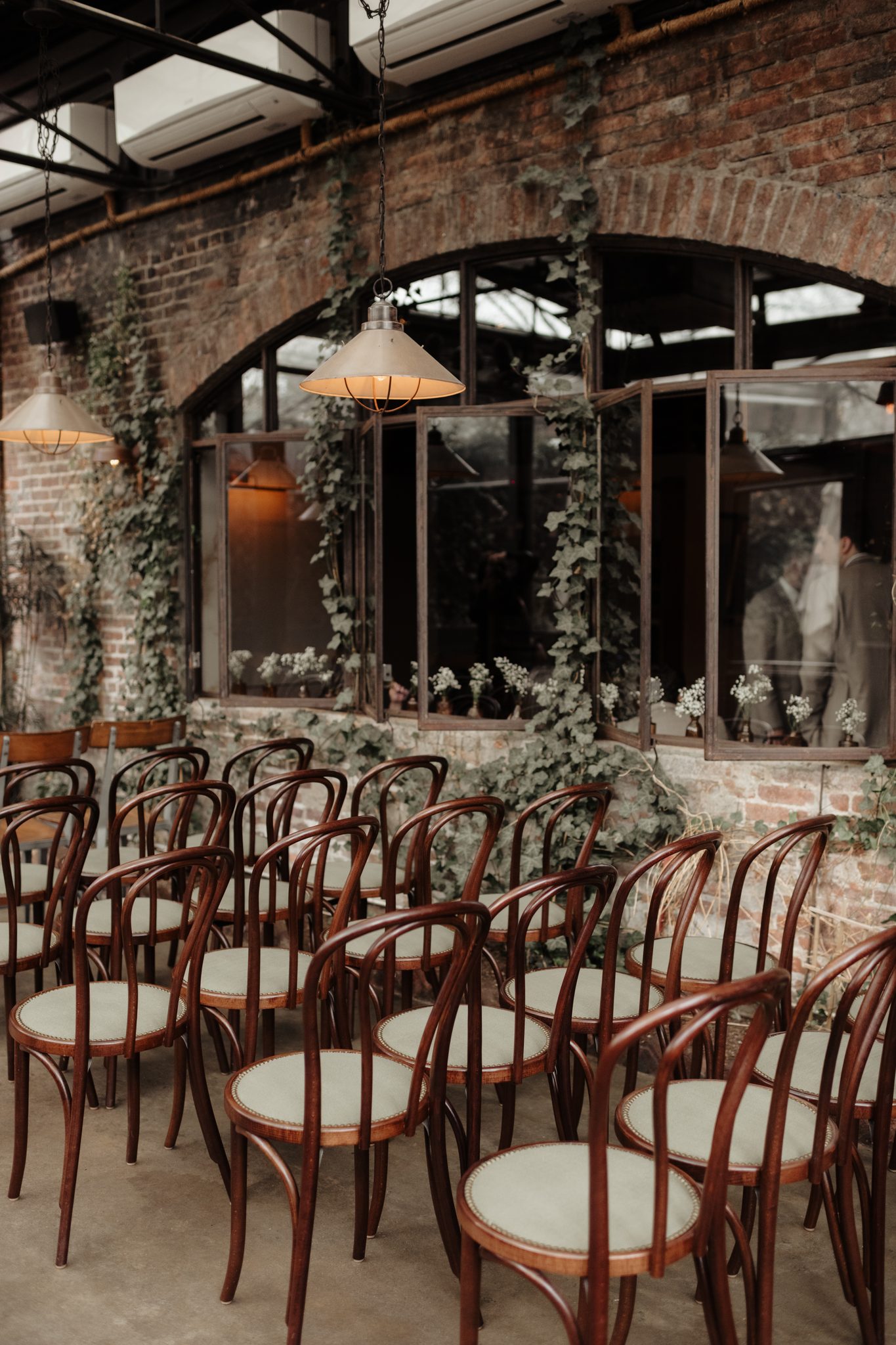 Bentwood ceremony chairs in the glass-roofed garden room at Aurora Brooklyn, Williamsburg | New York wedding photographer Tonie Christine