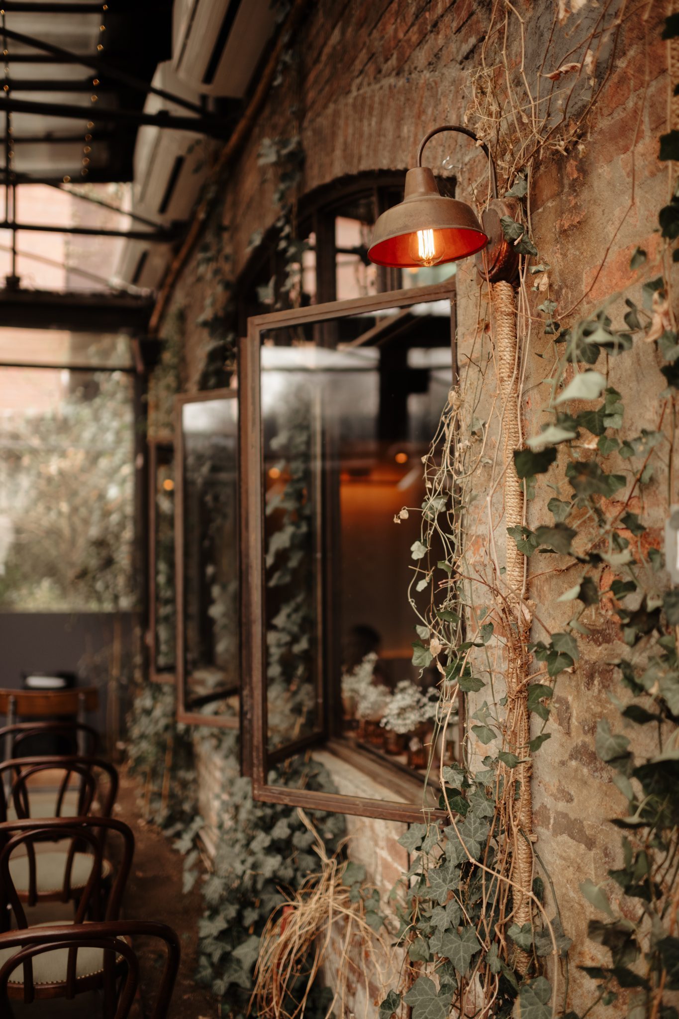 Ivy-covered brick wall and copper lamp at Aurora Brooklyn wedding venue in Williamsburg | New York wedding photographer Tonie Christine