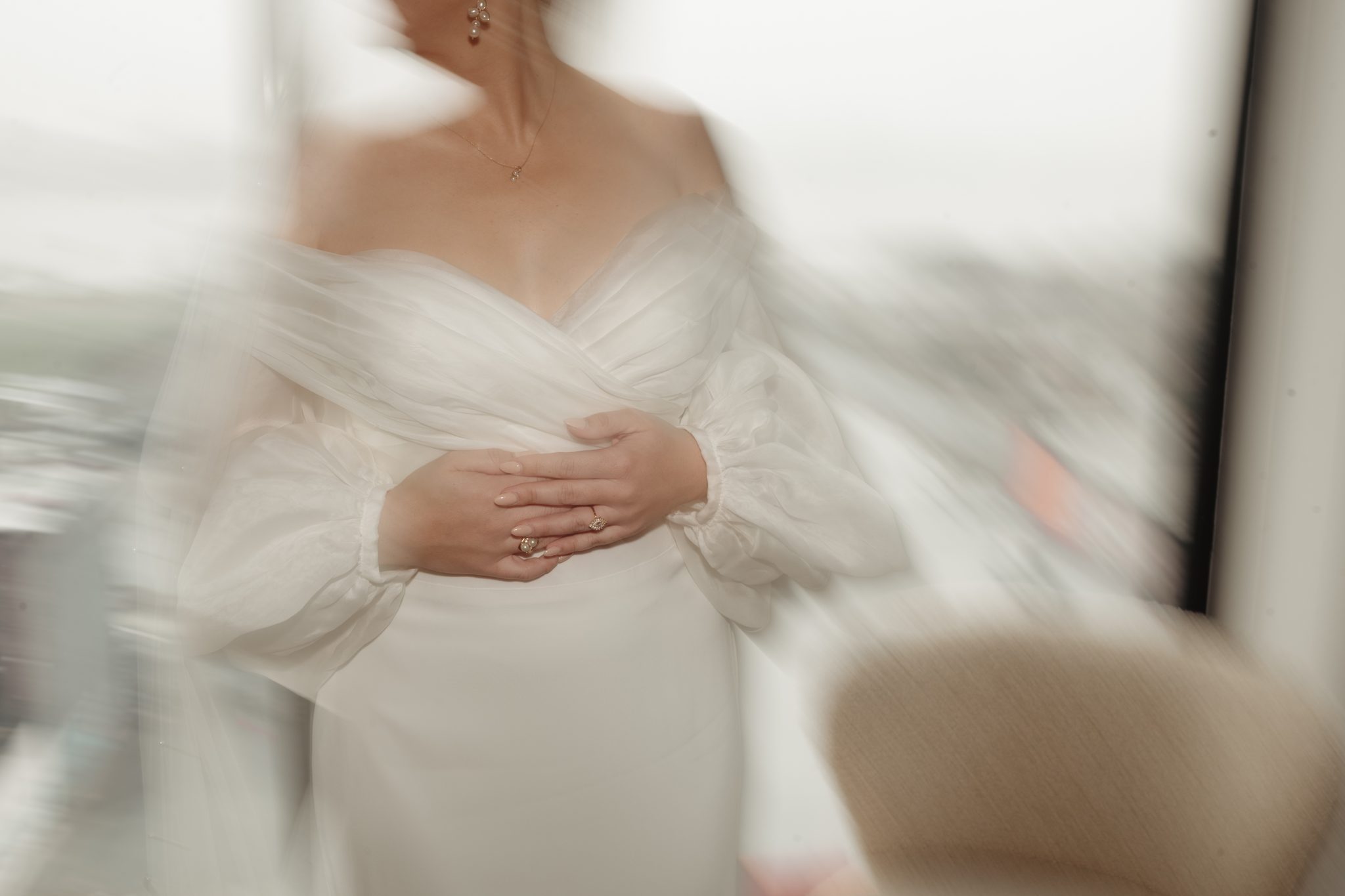 Editorial motion blur detail of an off-the-shoulder bridal gown, Aurora Brooklyn wedding in NYC | New York wedding photographer Tonie Christine