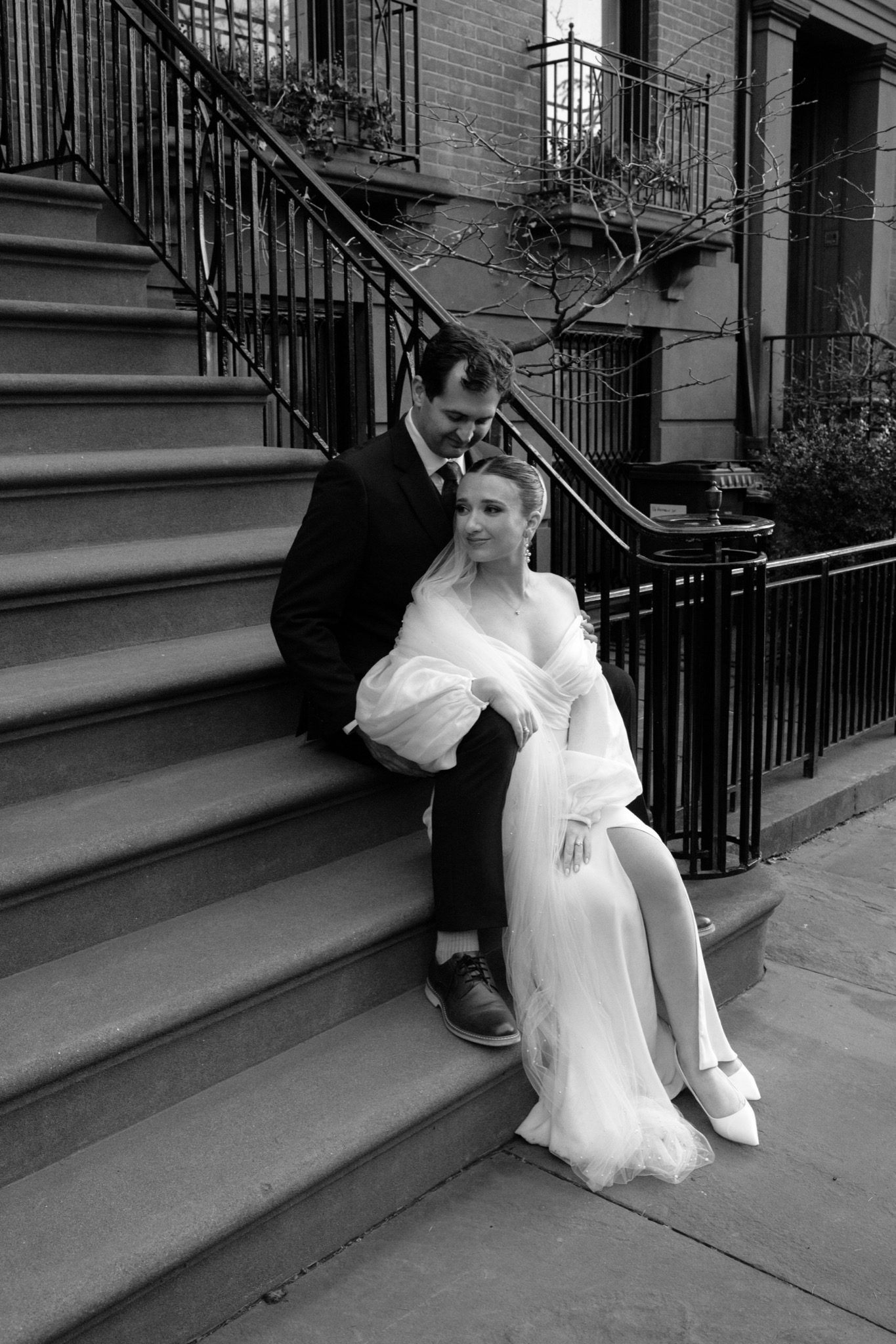 Black and white portrait of the bride on a Brooklyn brownstone stoop, NYC | New York wedding photographer Tonie Christine