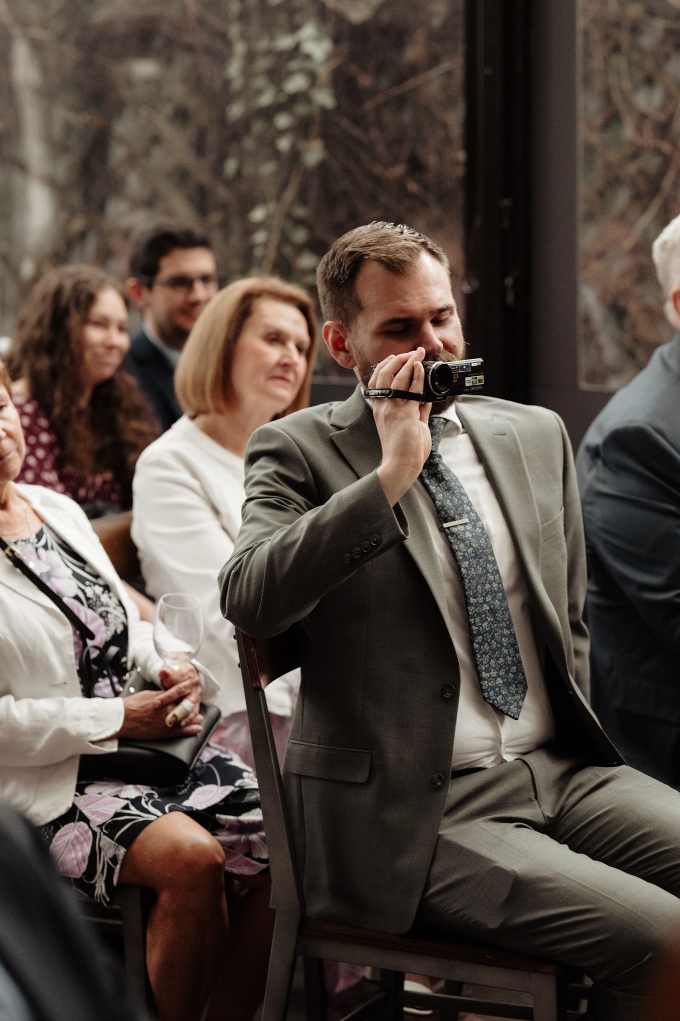 Wedding guest during the ceremony at Aurora Brooklyn in Williamsburg, Brooklyn | New York wedding photographer Tonie Christine