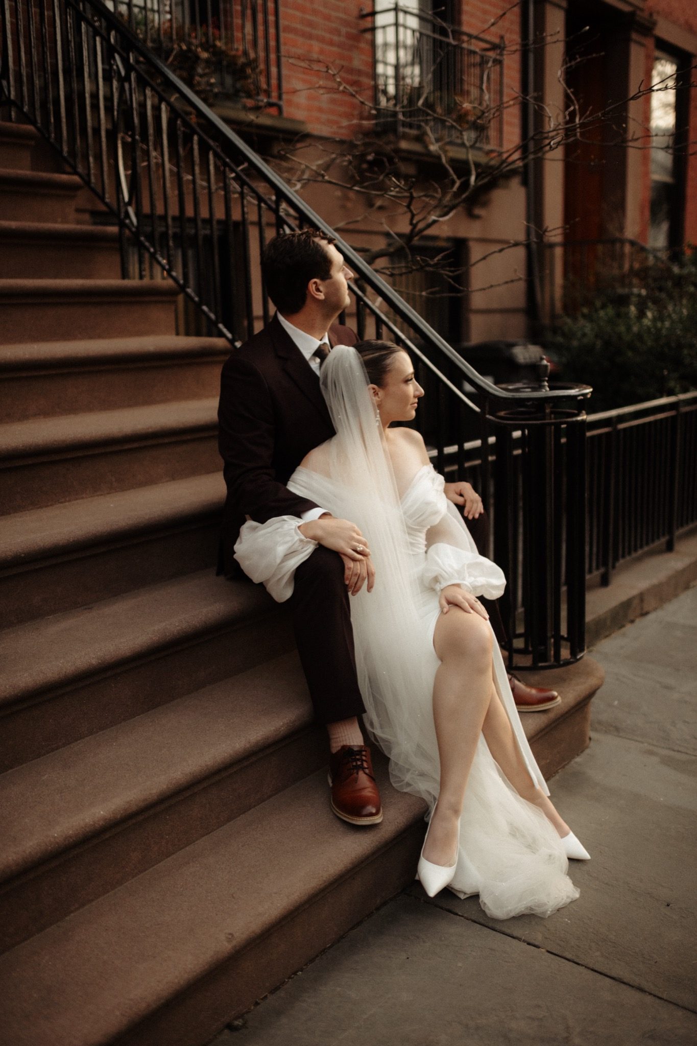 Bride and groom on a brownstone stoop in Brooklyn, NYC | New York wedding photographer Tonie Christine
