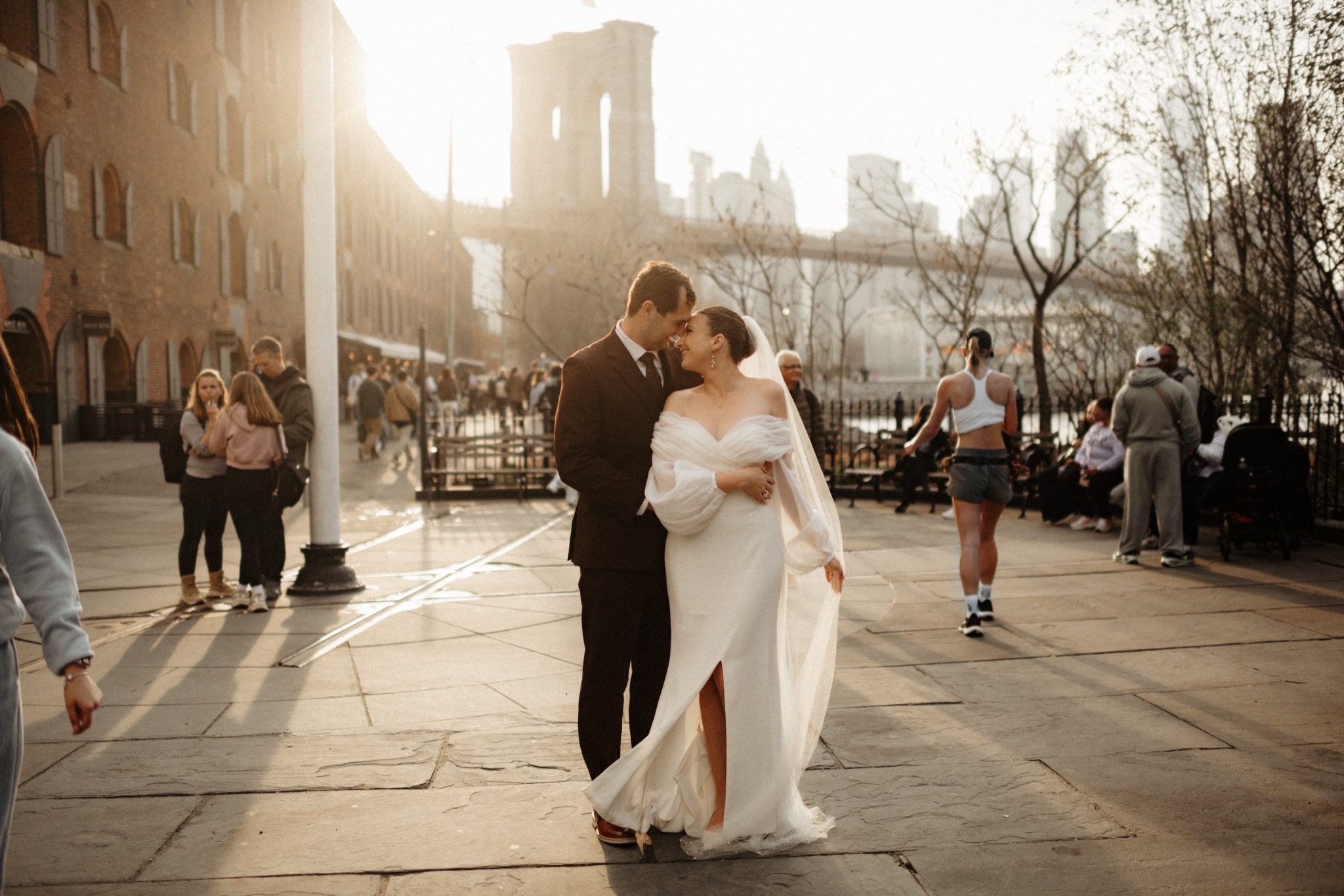 Bride and groom on a cobblestone street in DUMBO, Brooklyn for their NYC wedding portraits | New York wedding photographer Tonie Christine