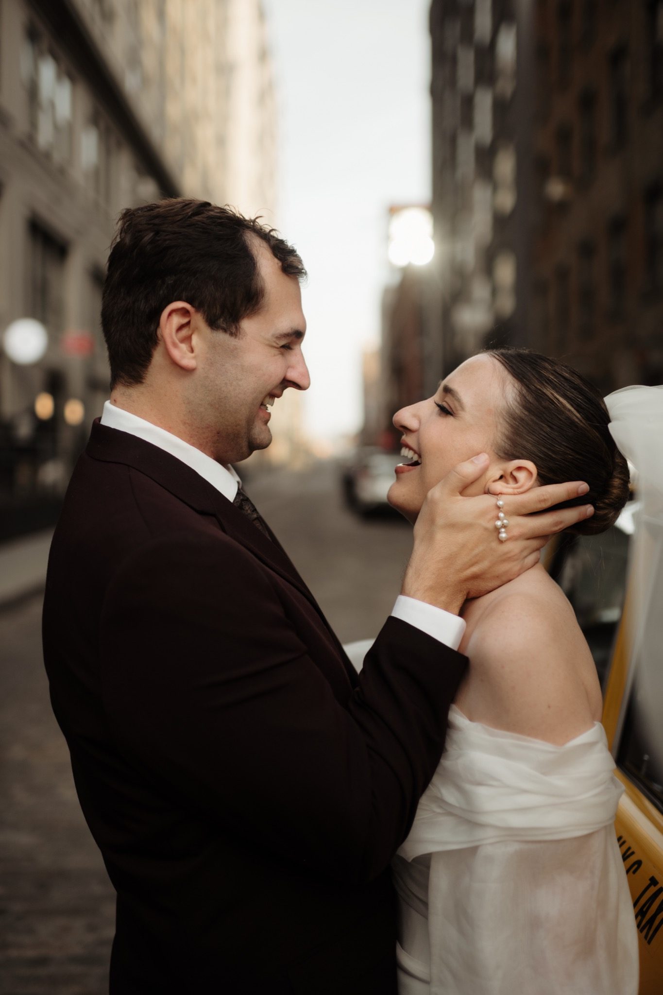 Close portrait of the bride and groom embracing in Brooklyn after their Aurora Brooklyn wedding | New York wedding photographer Tonie Christine