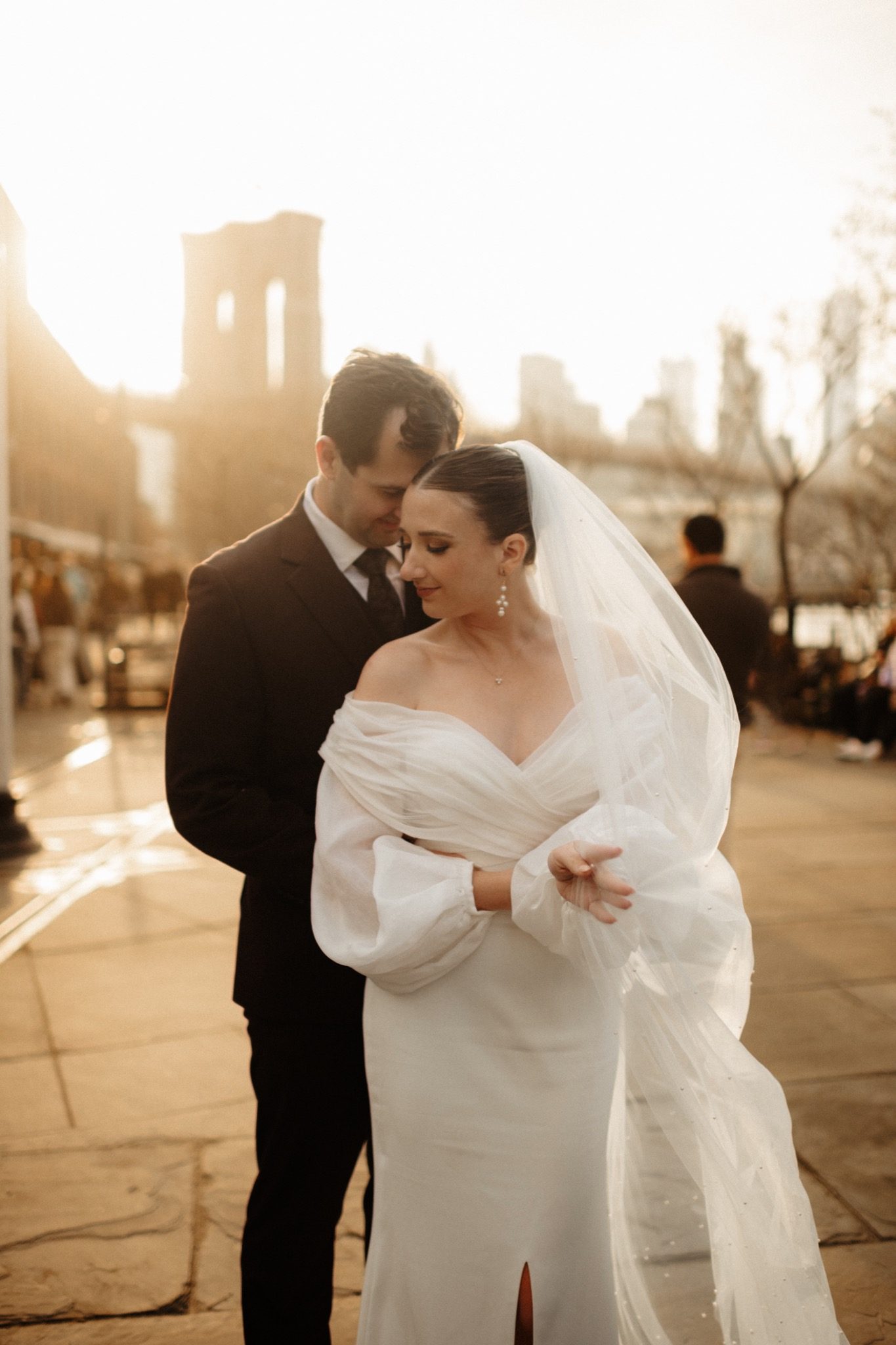 Golden hour portrait of the bride and groom near the Manhattan Bridge in Brooklyn, NYC | New York wedding photographer Tonie Christine