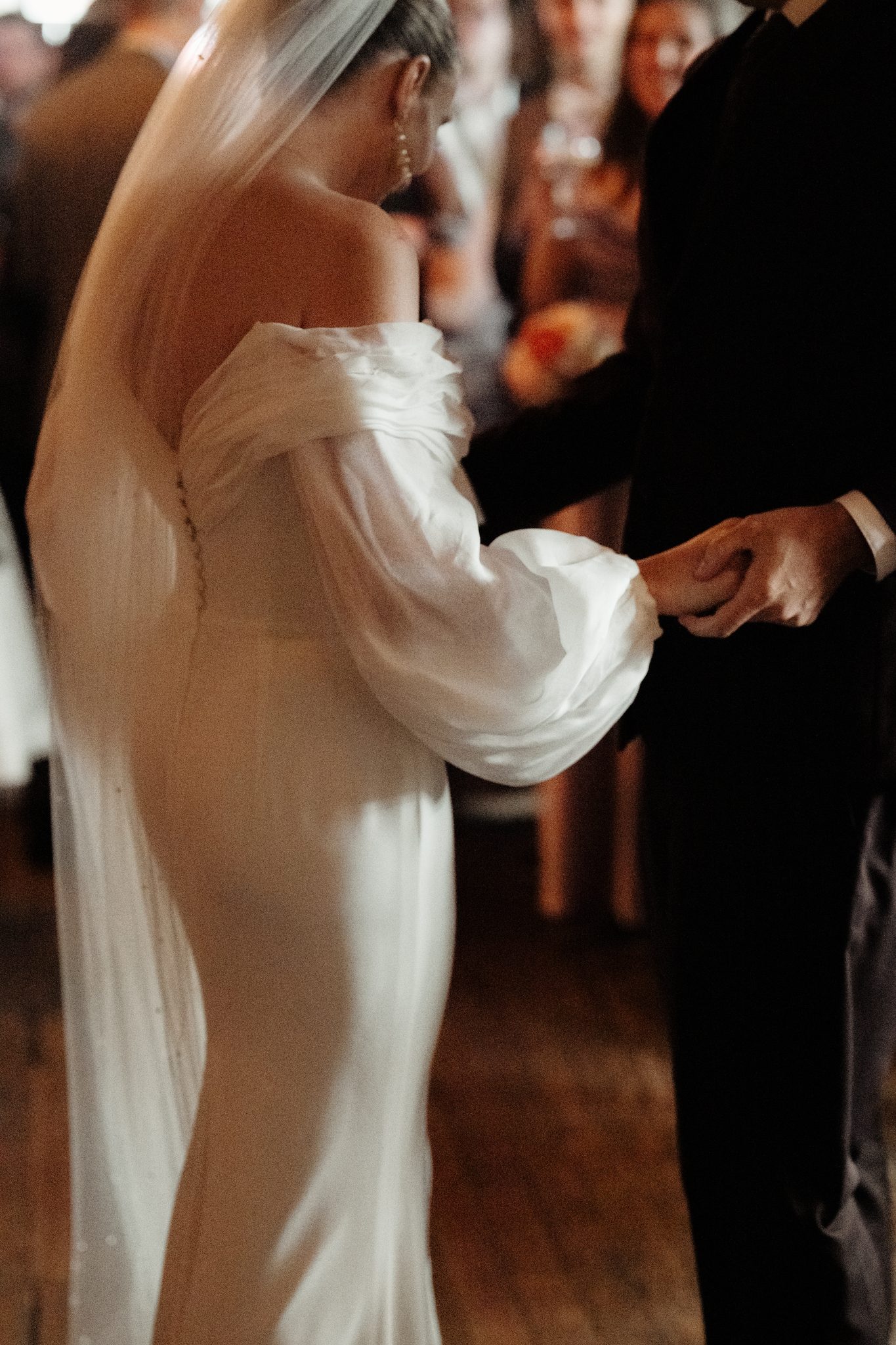 Bride and groom holding hands at their Aurora Brooklyn wedding reception in NYC | New York wedding photographer Tonie Christine