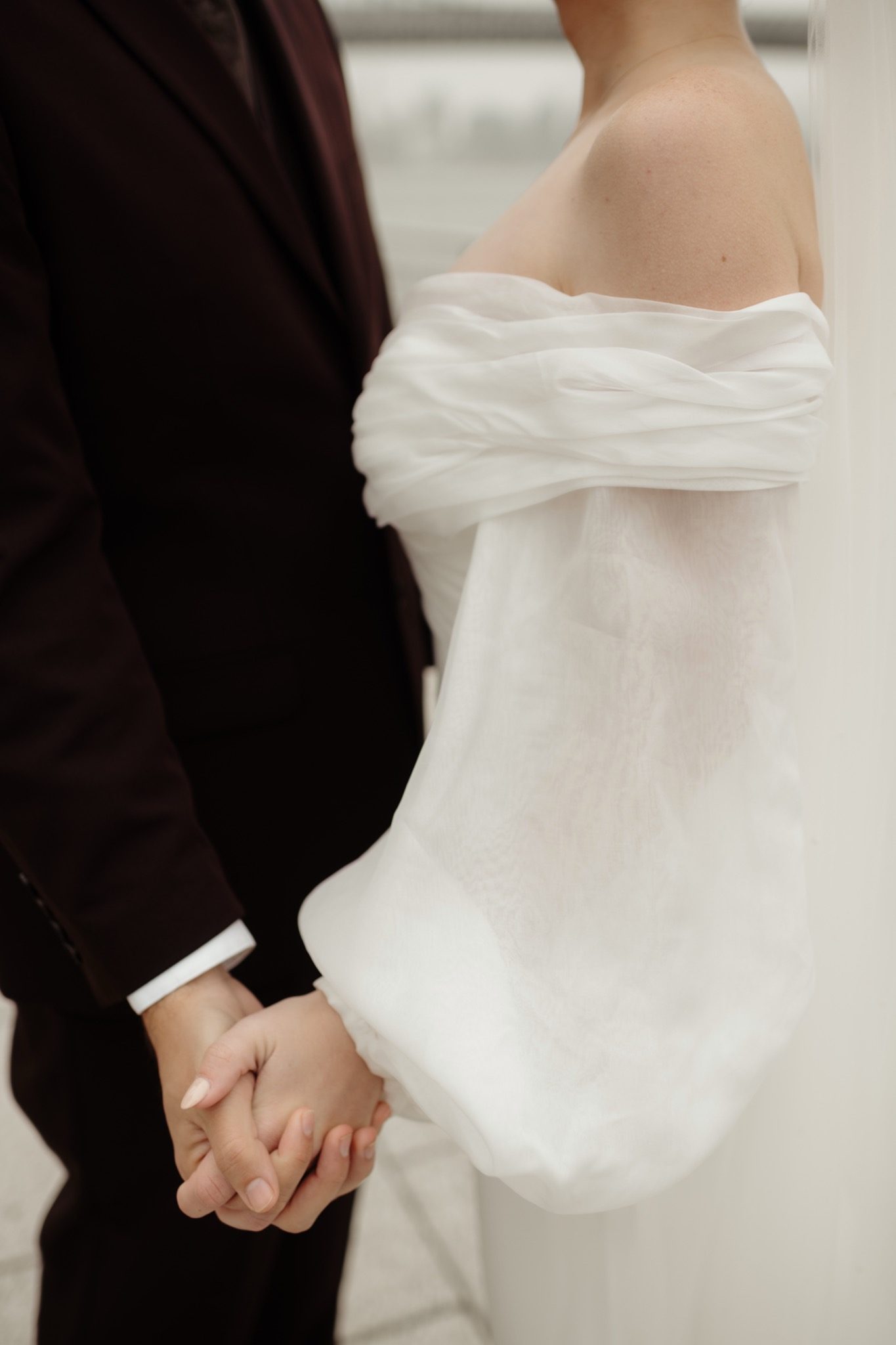Bride and groom holding hands in Williamsburg, Brooklyn before their Aurora Brooklyn wedding in NYC | New York wedding photographer Tonie Christine