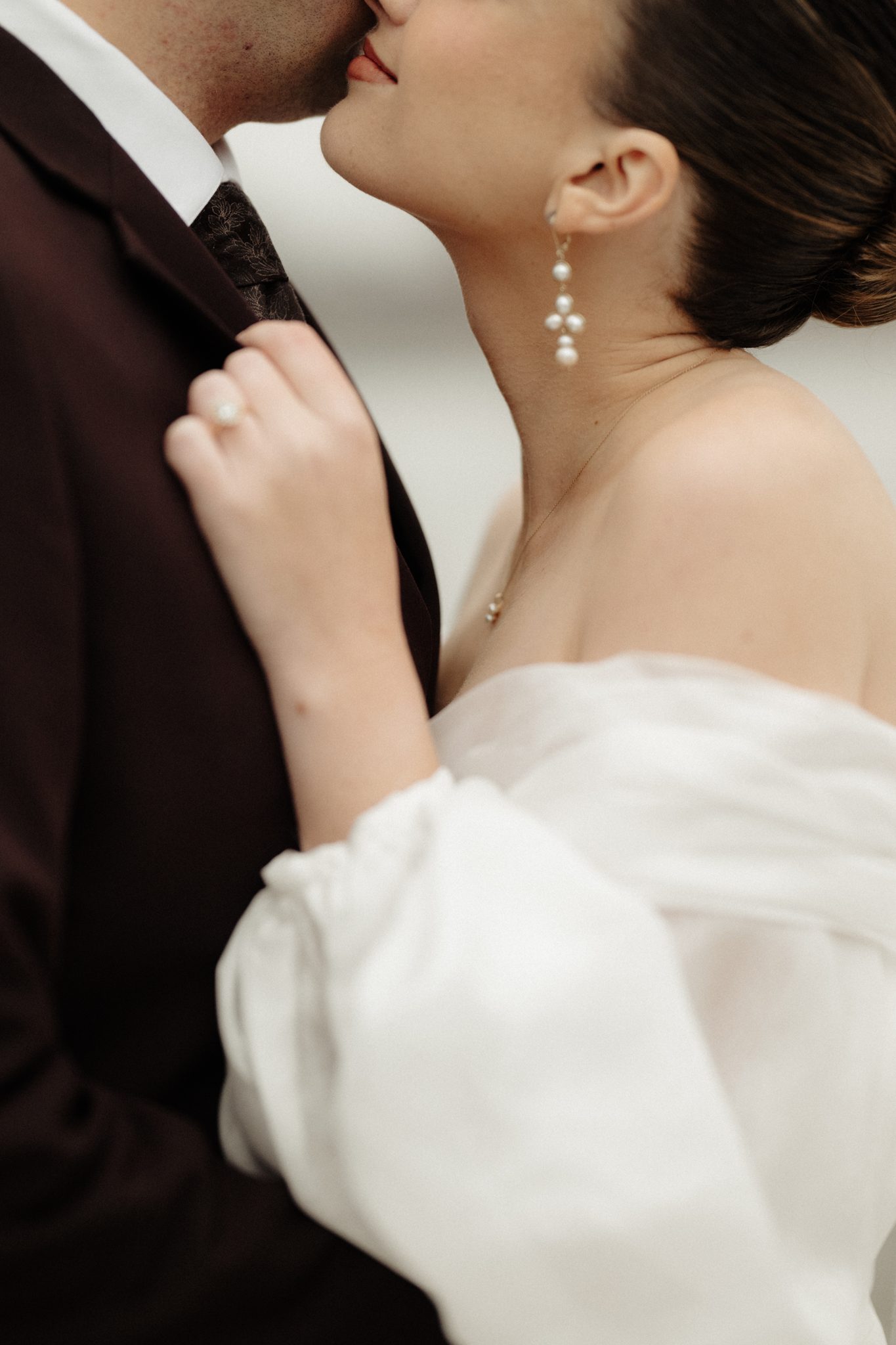 Romantic close-up of the bride and groom with pearl drop earrings, Brooklyn NYC wedding | New York wedding photographer Tonie Christine
