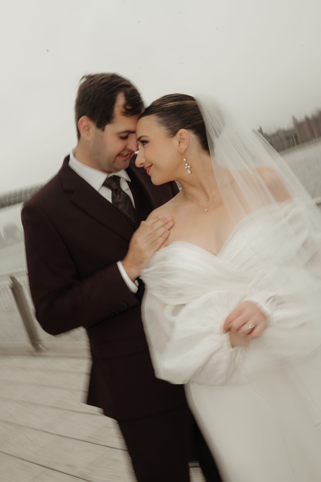 Bride and groom portrait on the East River waterfront in Williamsburg, Brooklyn | New York wedding photographer Tonie Christine